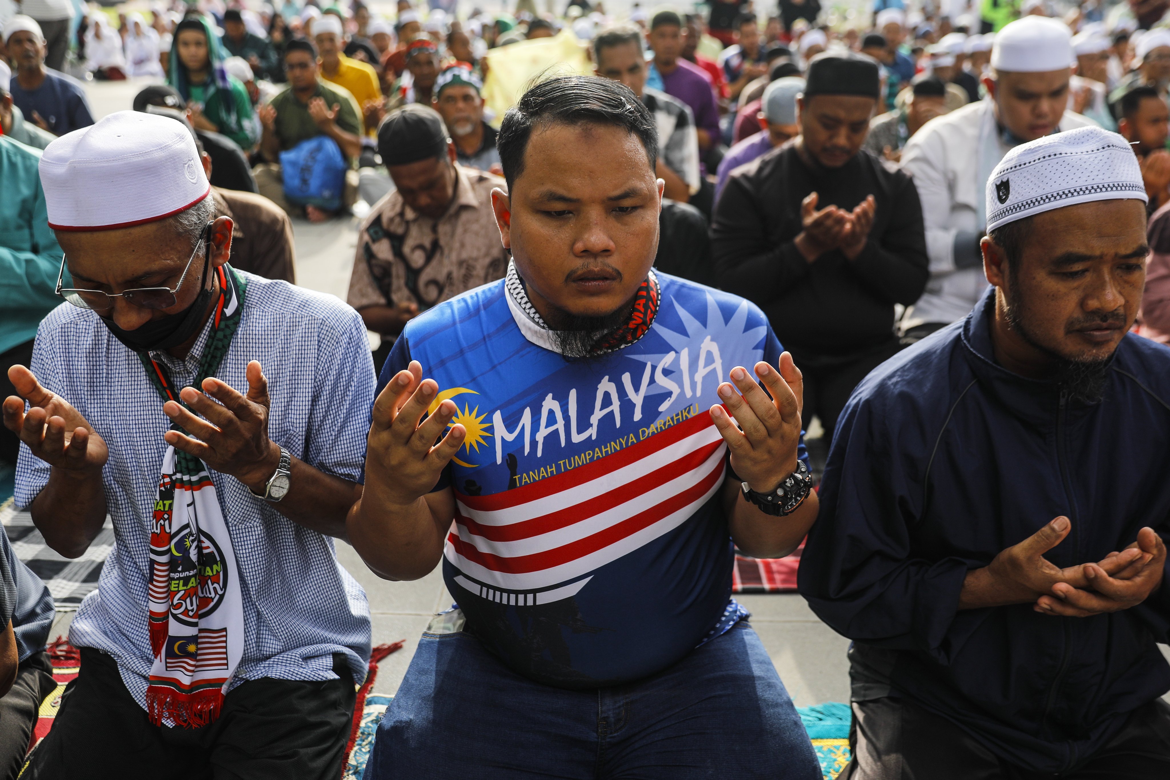 Malaysian Muslims pray outside the Federal Court in Putrajaya in February. Photo: EPA-EFE