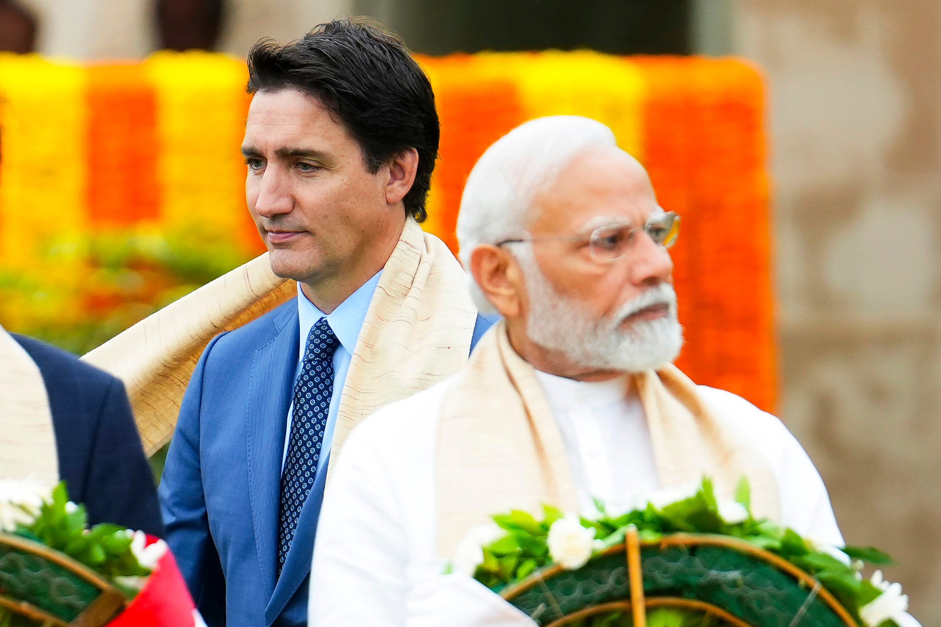 Canada’s Prime Minister Justin Trudeau walks past India’s Prime Minister Narendra Modi as they take part in a wreath-laying ceremony at Raj Ghat, Mahatma Gandhi’s cremation site, during the G20 Summit in New Delhi in September 2023. Photo: Canadian Press via AP