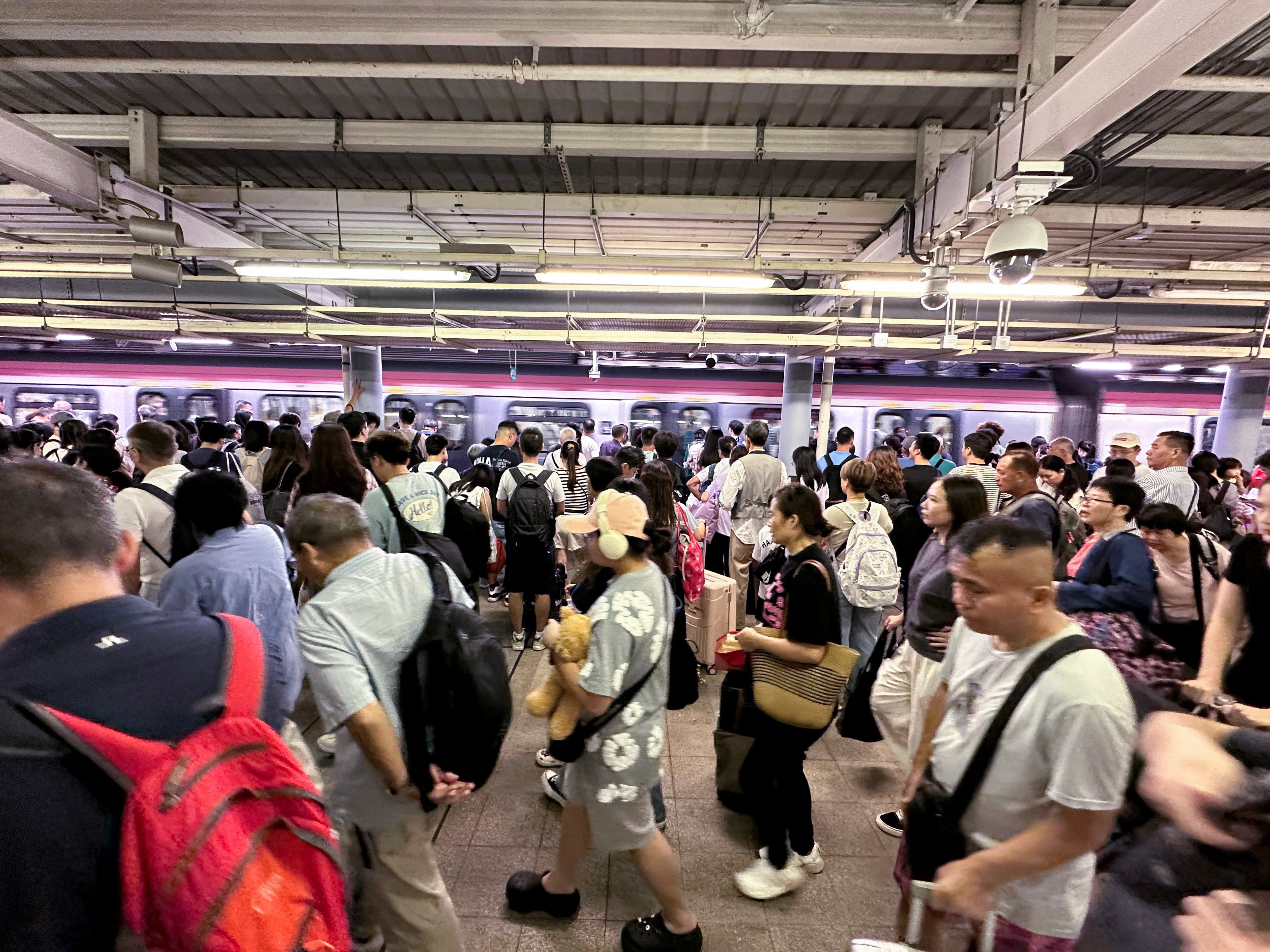 Travellers arrive at Lo Wu from mainland China on Sunday. Photo: Oscar Liu